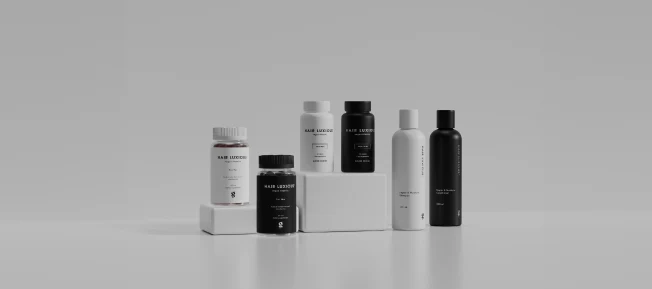 Produkter från Hair Luxious uppradadde bredvid varandra mot en vit bakgrund.