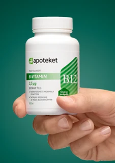 En hand visar upp kosttillskottet "B-VITAMIN" från apoteket.