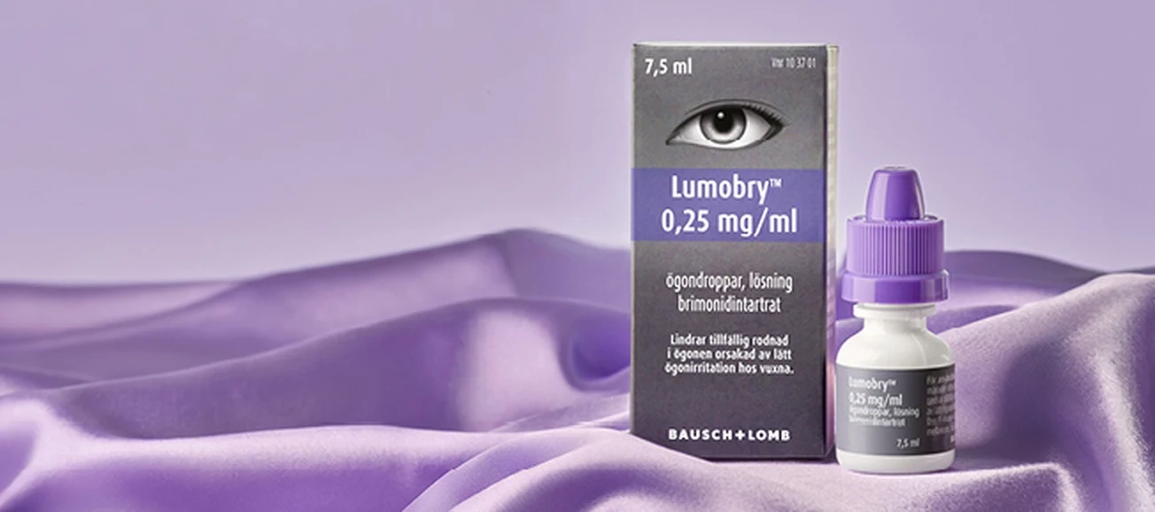 En förpackning och en flaska från varumärket Lumobry på ett lila underlag.