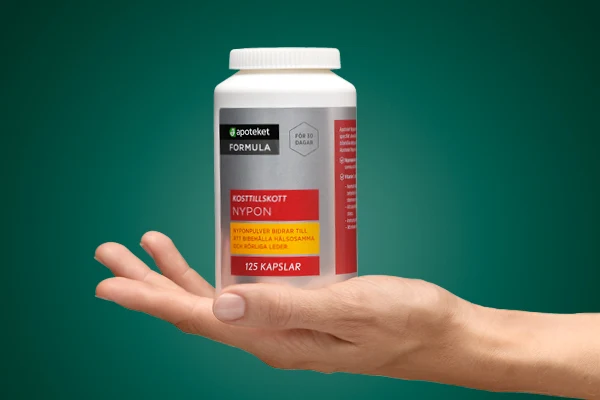 En hand visar upp kosttillskottet "FORMULA" från apoteket.