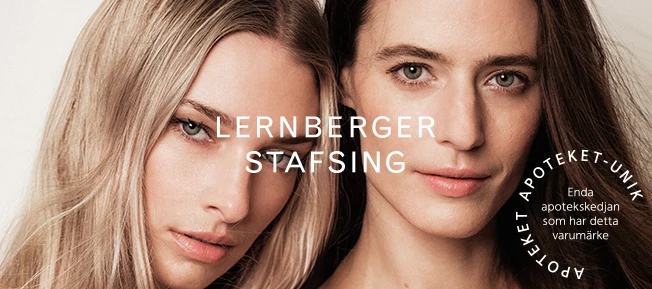 Två kvinnor poserar nära varandra mot en ljus bakgrund med texten "Lernberger Stafsing" och en cirkel med text som nämner Apoteket Unik.