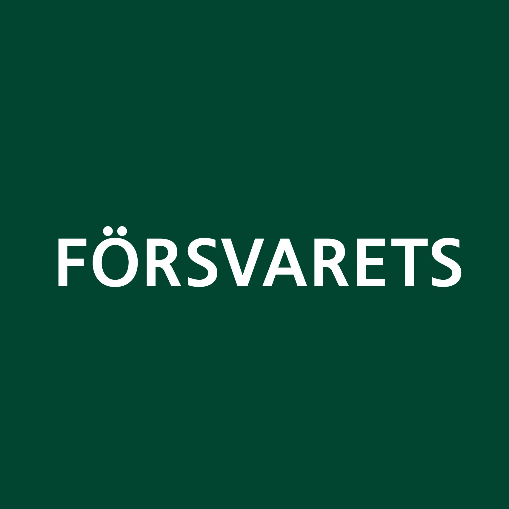 Logotyp för Försvarets mot en grön bakgrund.