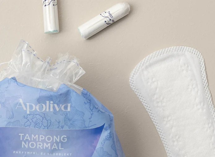 Apoliva mensskydd: tamponger och trosskydd på beige bakgrund.